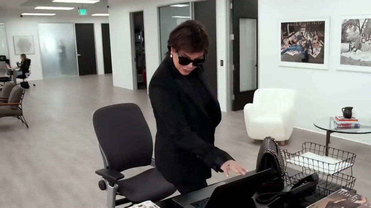 Kris Jenner looking at a laptop