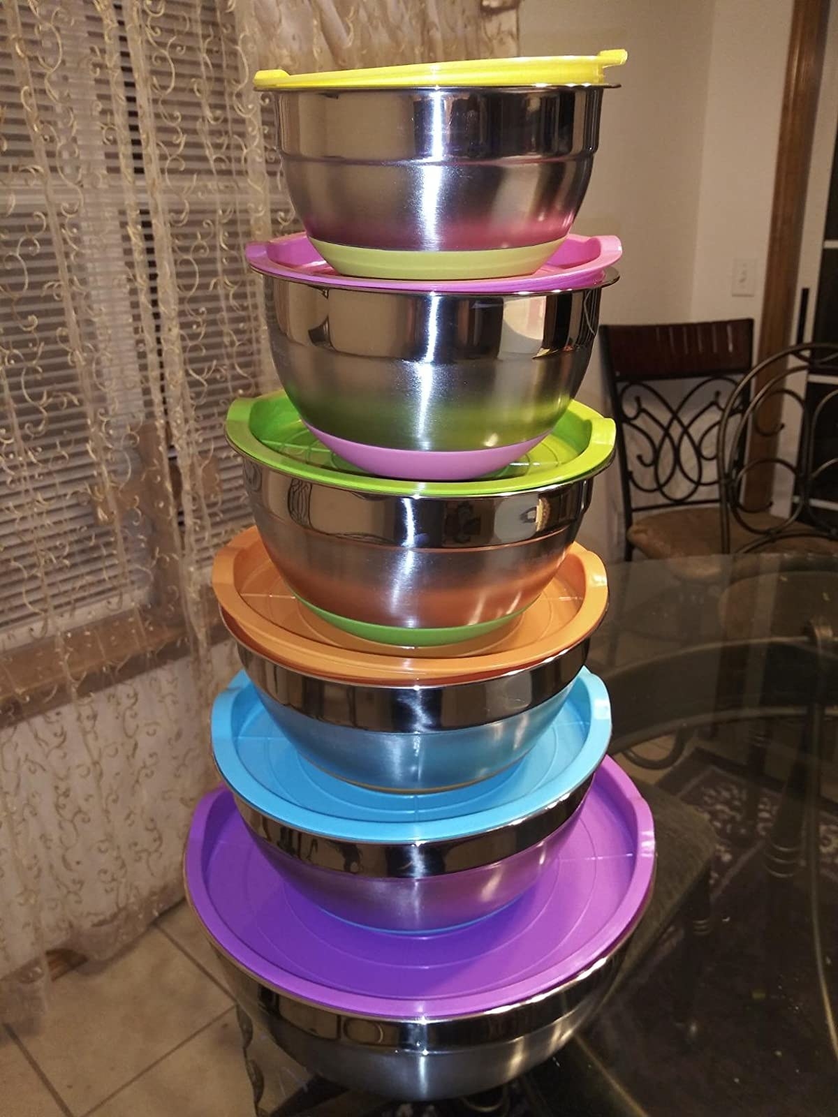 A reviewer photo of the bowls, stacked on top of each other, with their lids on top