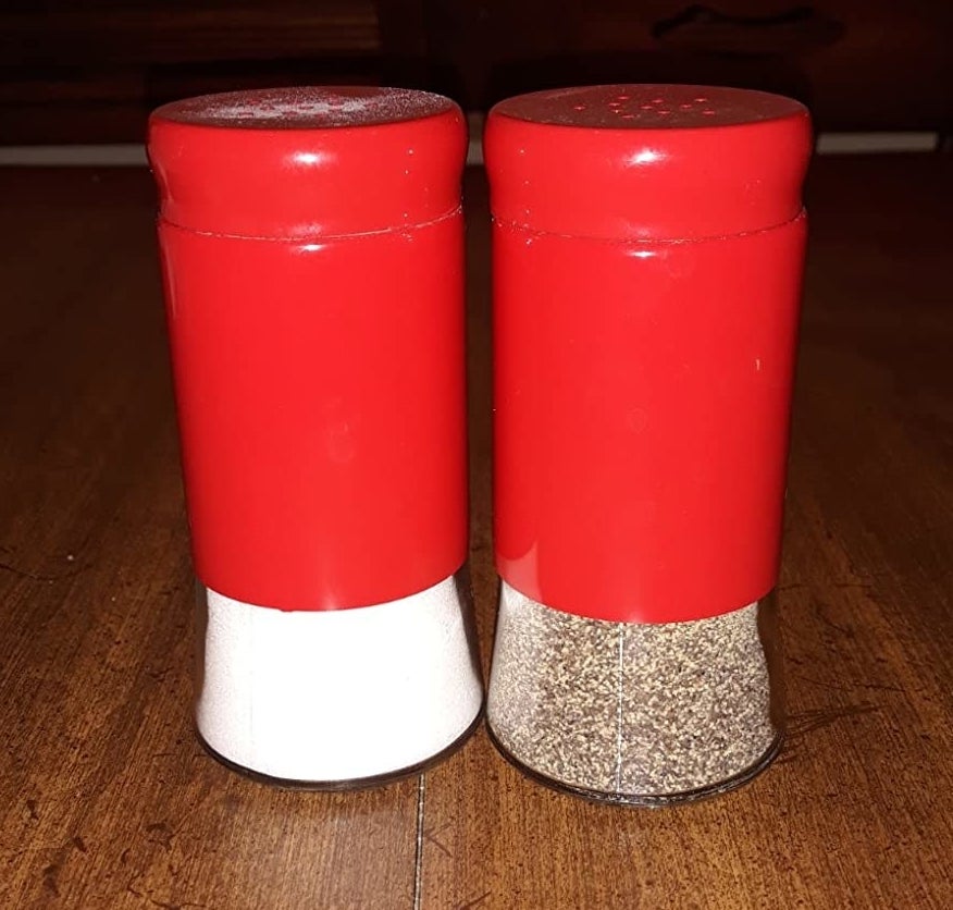 A reviewer photo of the salt and pepper shakers in red