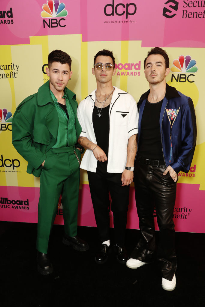 (L to R) Nick Jonas, Joe Jonas, and Kevin Jonas of Jonas Brothers arrive to the 2021 Billboard Music Awards