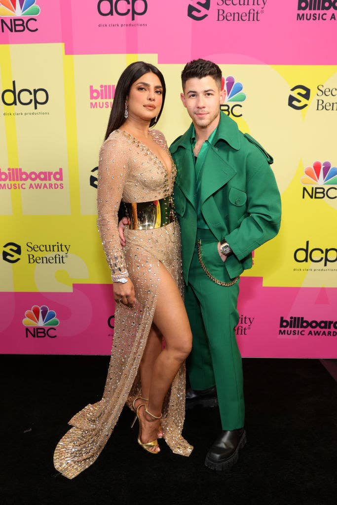 (L-R) Priyanka Chopra Jonas and Nick Jonas pose backstage for the 2021 Billboard Music Awards
