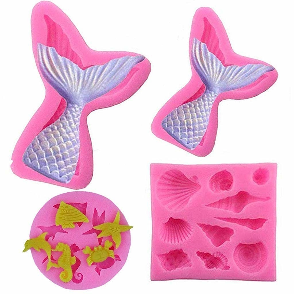 Cute pink silicone mould with a crab, sea-horse, starfish, crab and fish, a seashells mould and a mermaid tail mould
