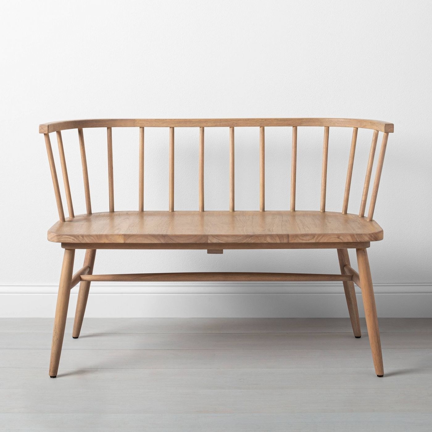 White oak bench with vertical bars along the backside