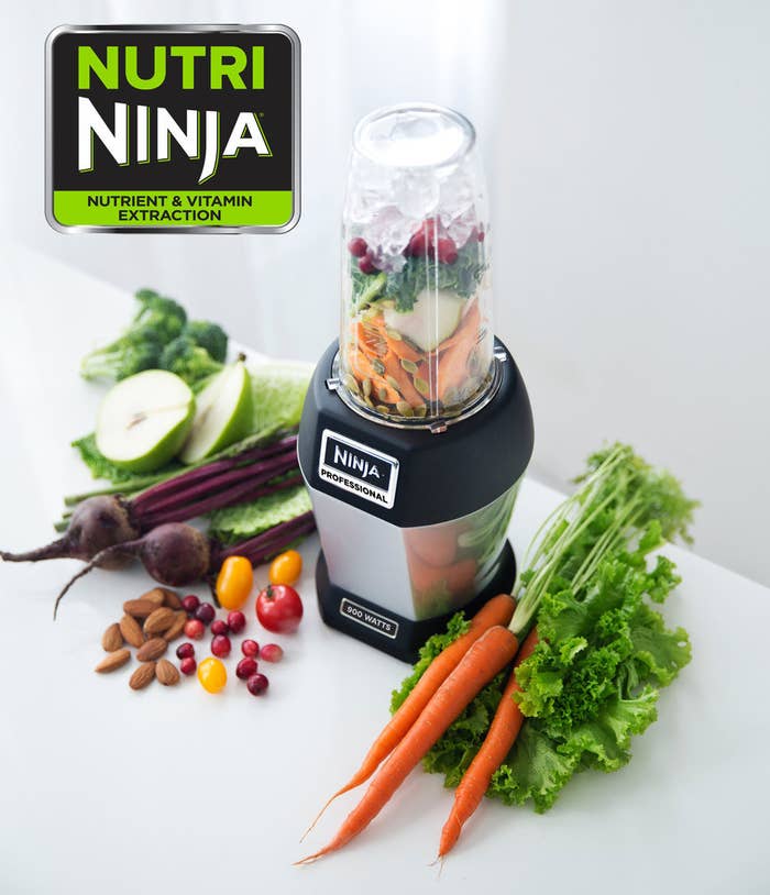 the nutri ninja single serve blender with veggies in its cup compartment