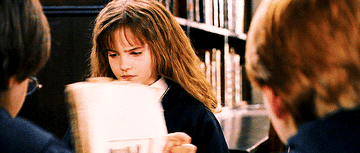 Hermoine Granger studying with a book.