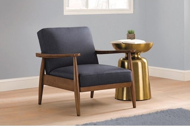 low chair with wooden legs and grey fabric