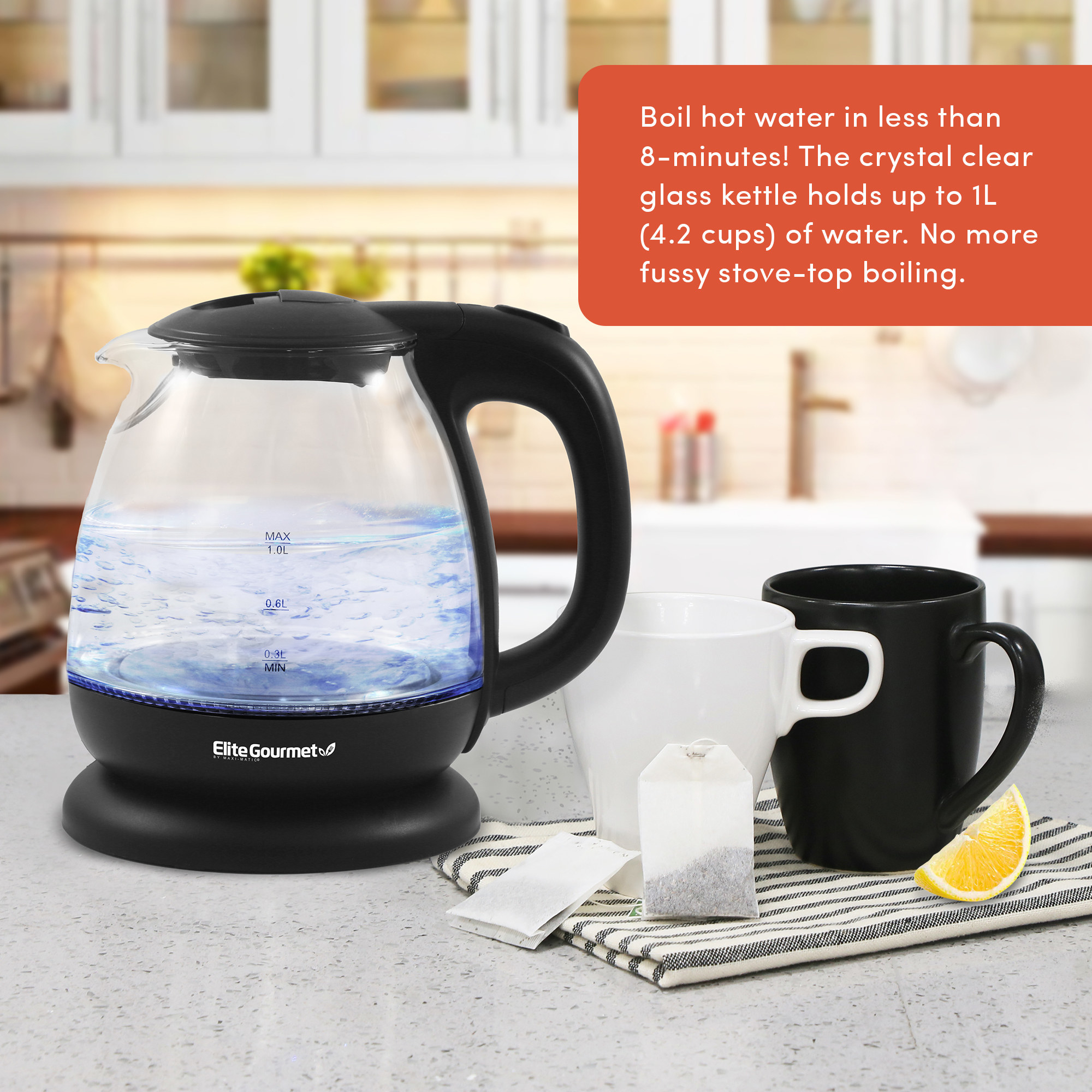 a transparent electric kettle with black details that has boiling water in it