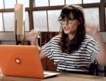 Jess from &quot;New Girl&quot; cheering at her computer