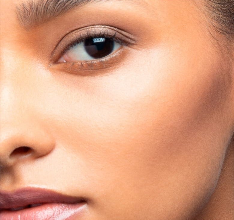 A model wears the product in Natural