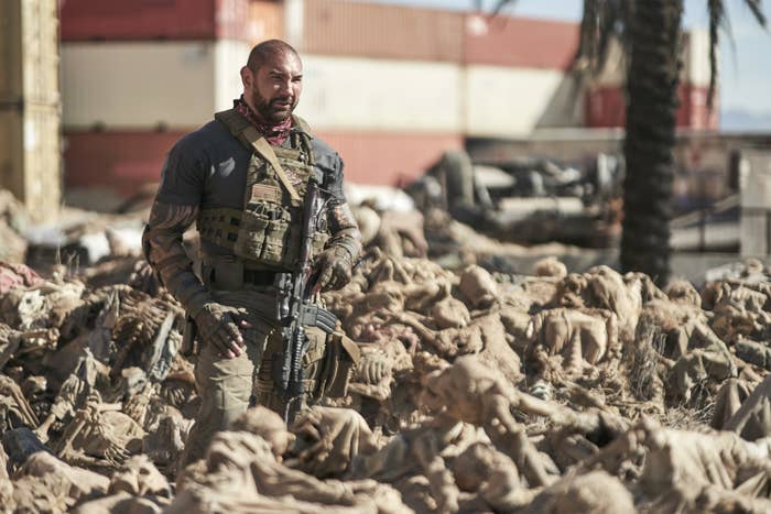 Dave Bautista holding a gun in a scene from Army of the Dead