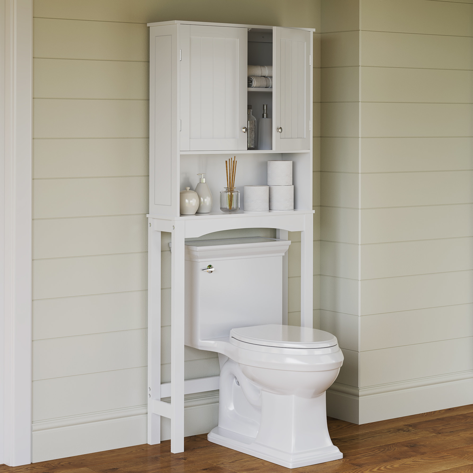 the white storage cabinet placed over a toilet