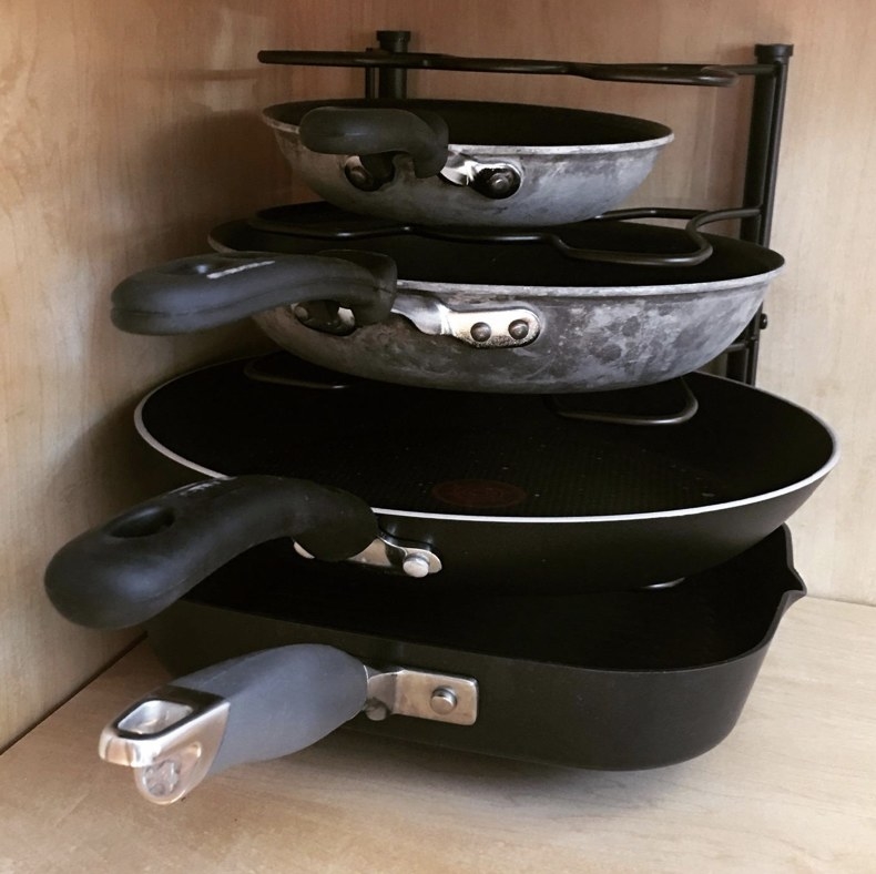 A reviewer&#x27;s pots and pans cabinet organizer