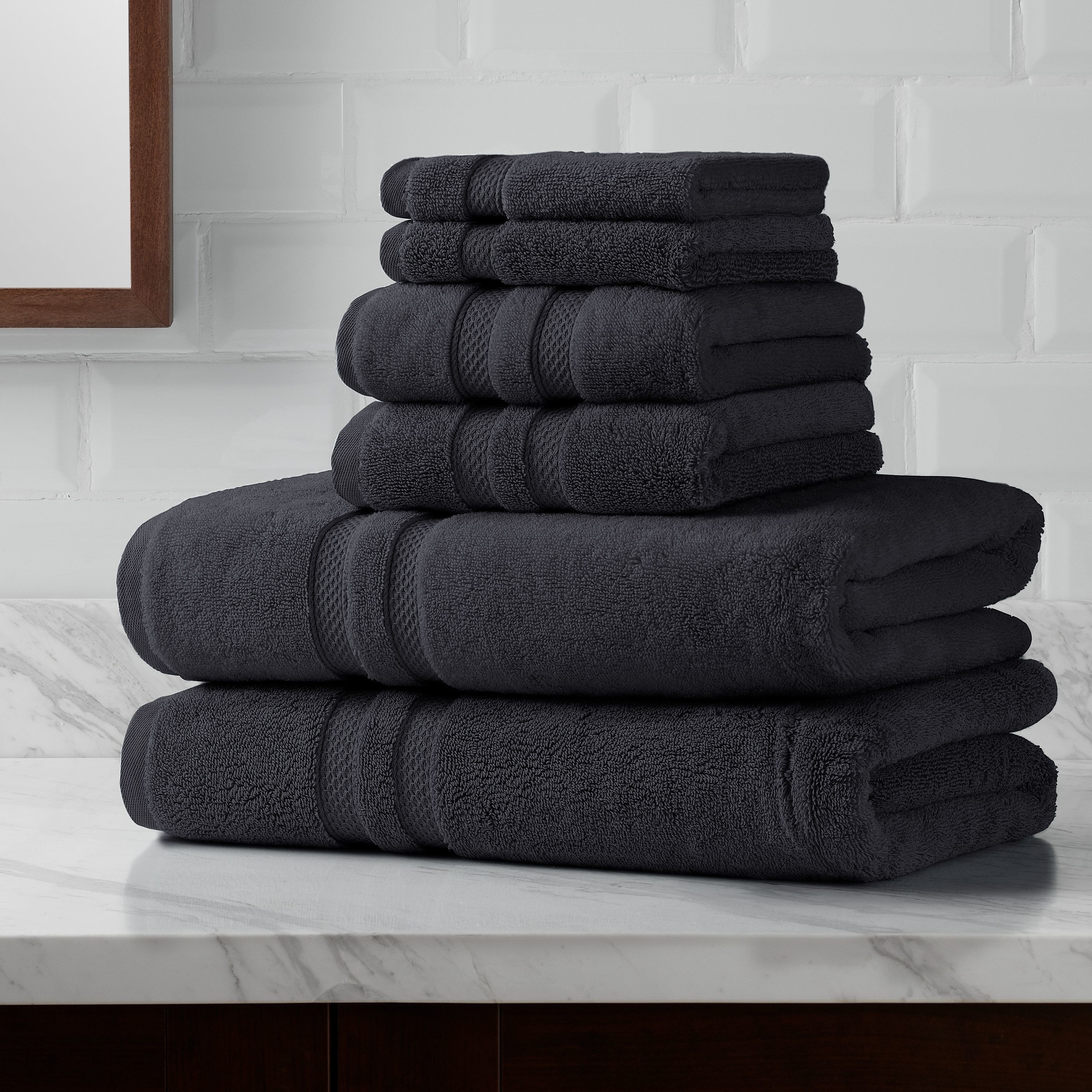 the 6-piece granite turkish towel set folded and stacked on top of one another