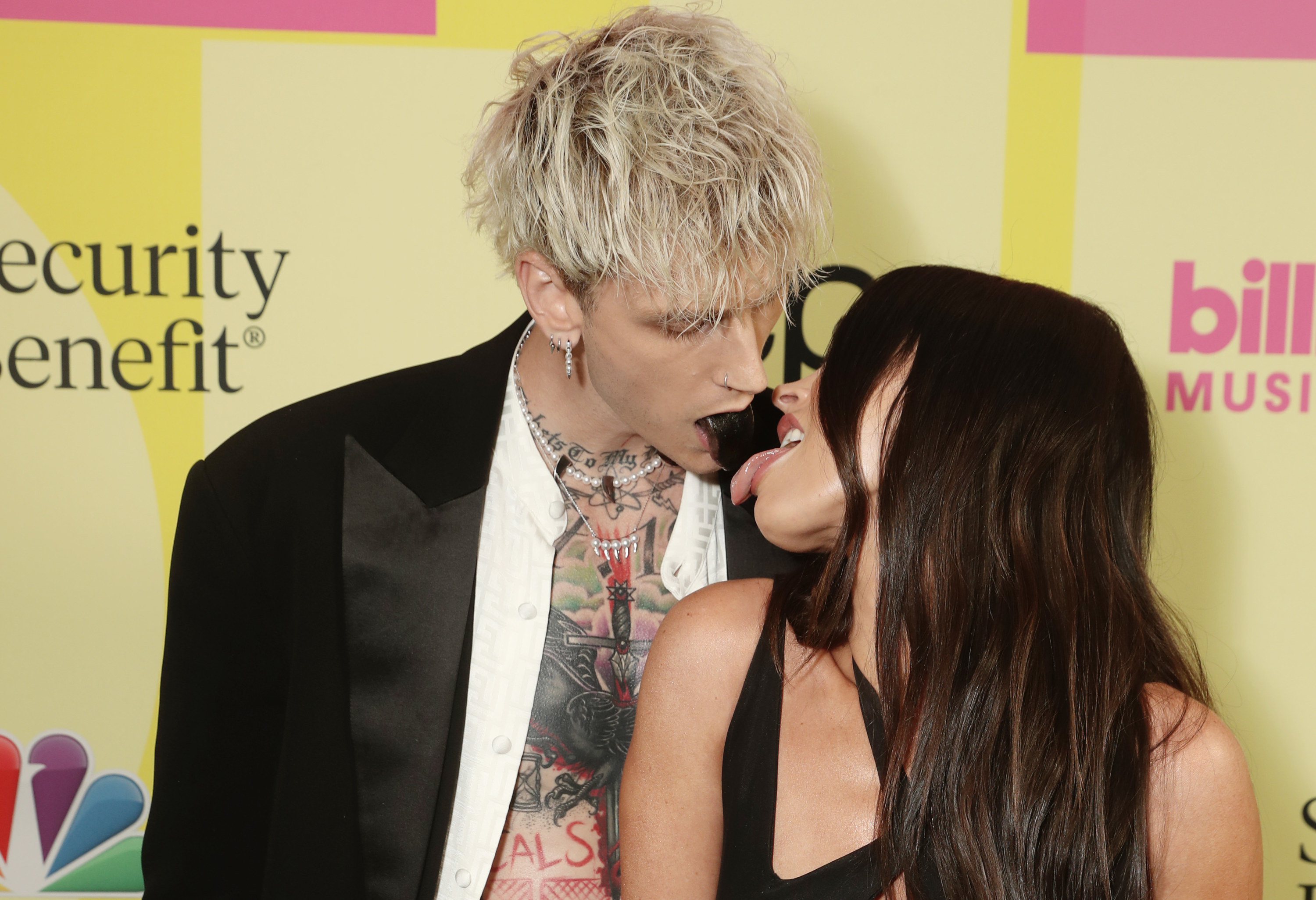 Megan Fox licks Machine Gun Kelly&#x27;s black tongue at the Billboard Music Awards