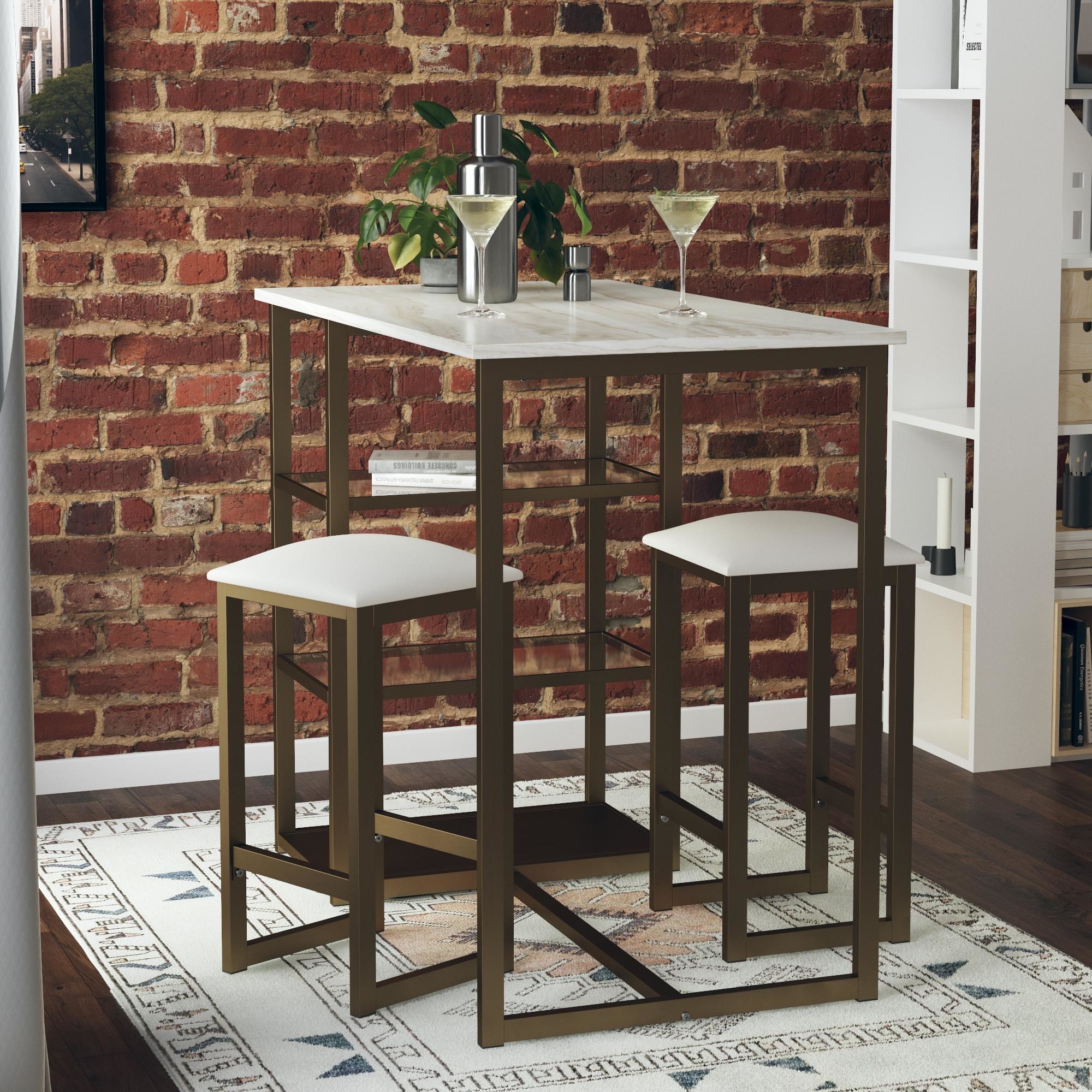the faux marble table and stools with gold accented legs