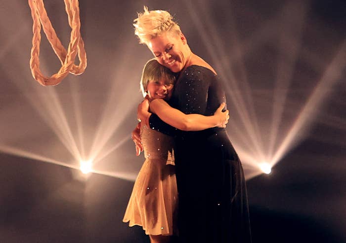 Pink hugs her daughter on stage