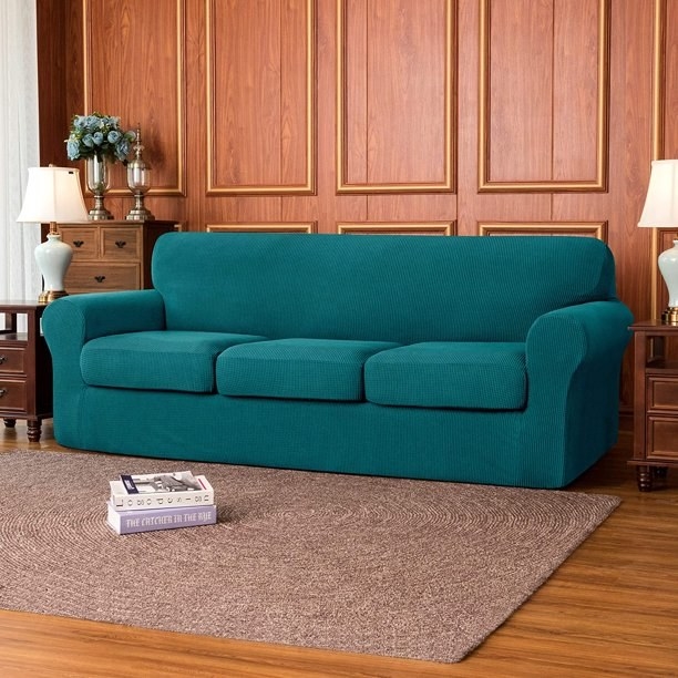 The cover in turquoise slipped over a couch