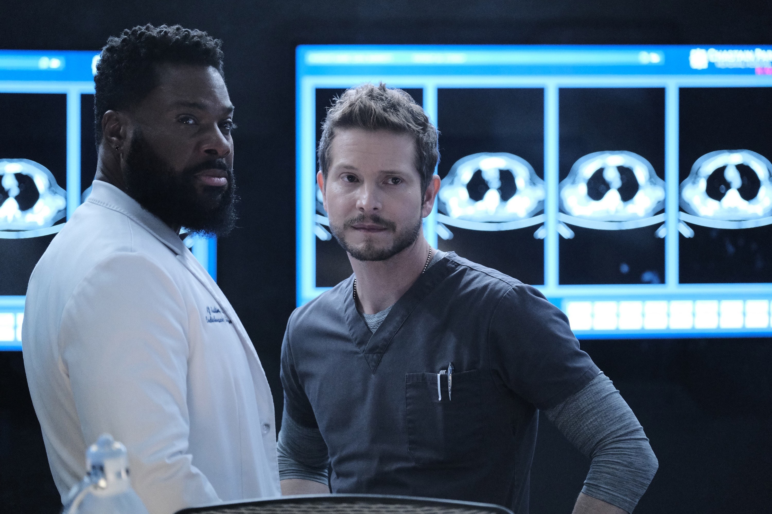 Conrad and AJ contemplating a patient&#x27;s case on The Resident