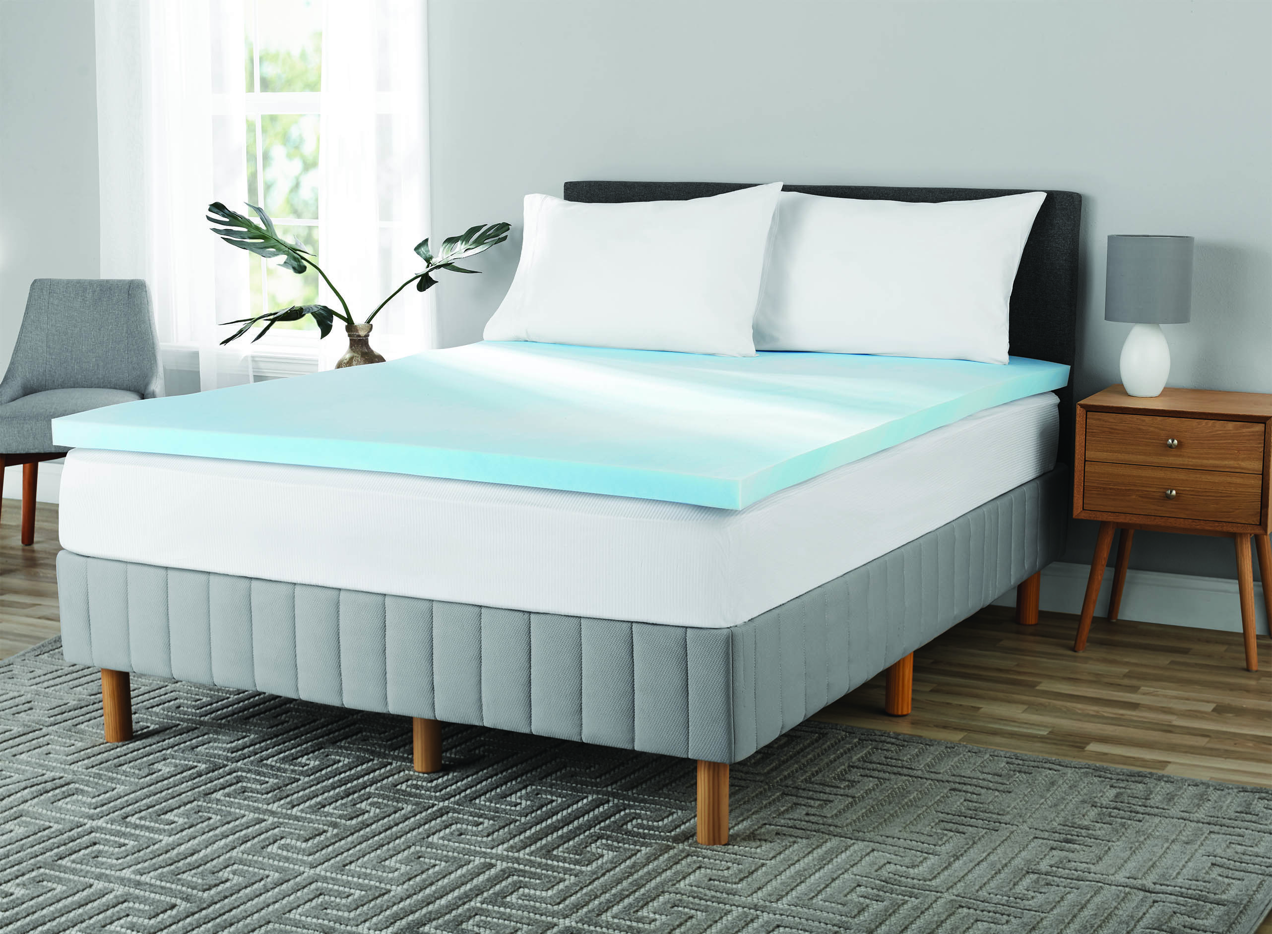 the mainstays 2 inch gel infused mattress topper on a bed in a bedroom