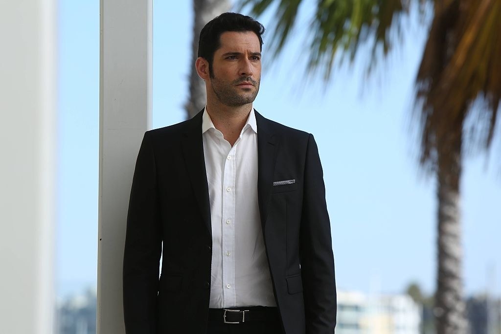 Lucifer standing in a suit