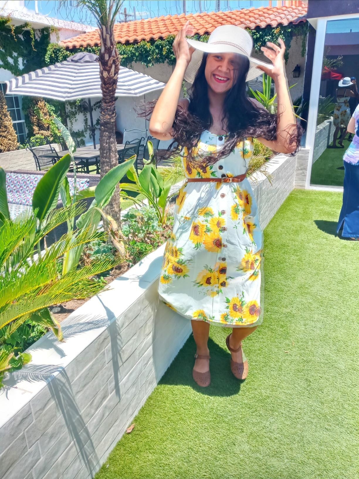 A reviewer photo of the dress in sunflower print