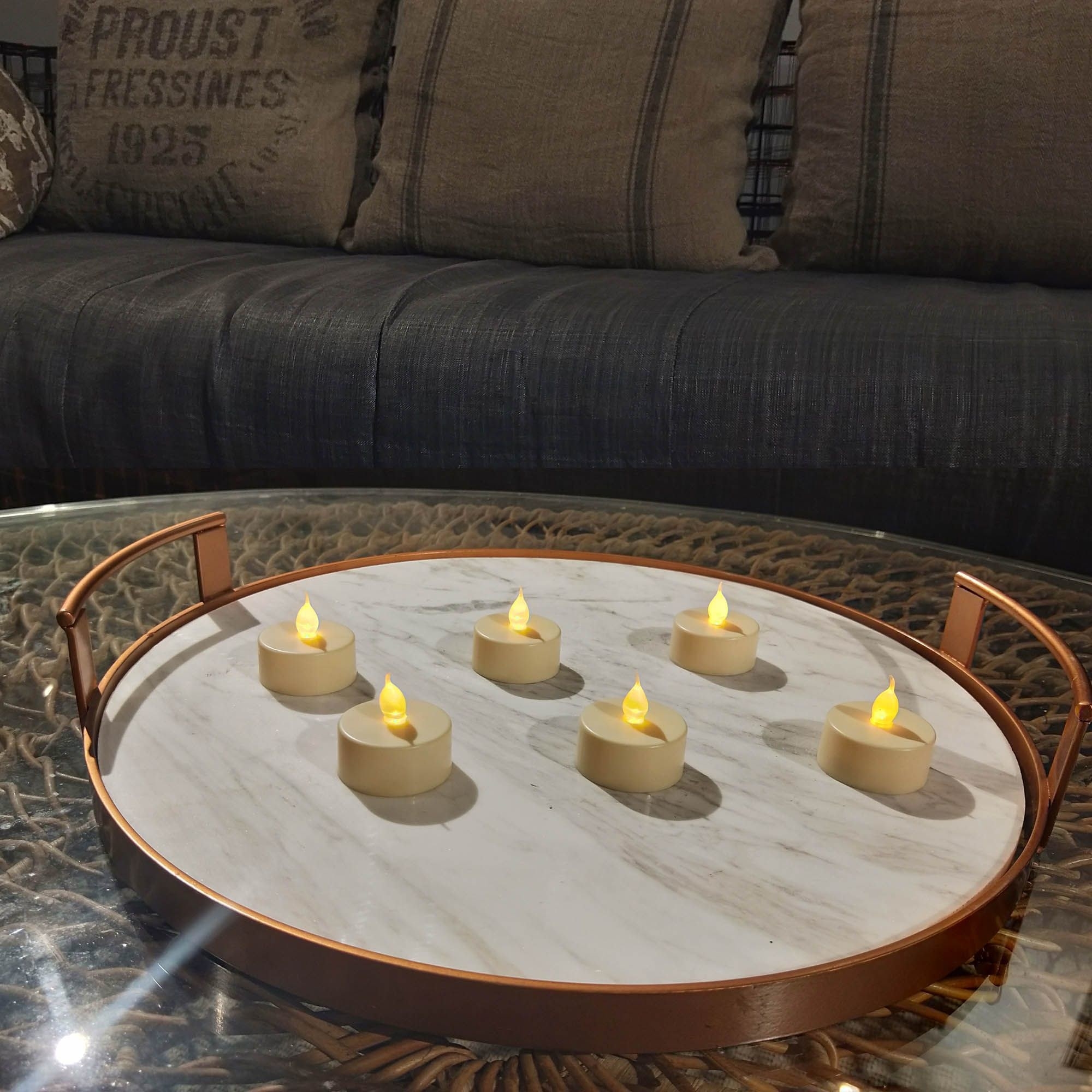 Six flameless tea lights on a coffee table 
