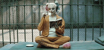 Harley sipping espresso in her cell