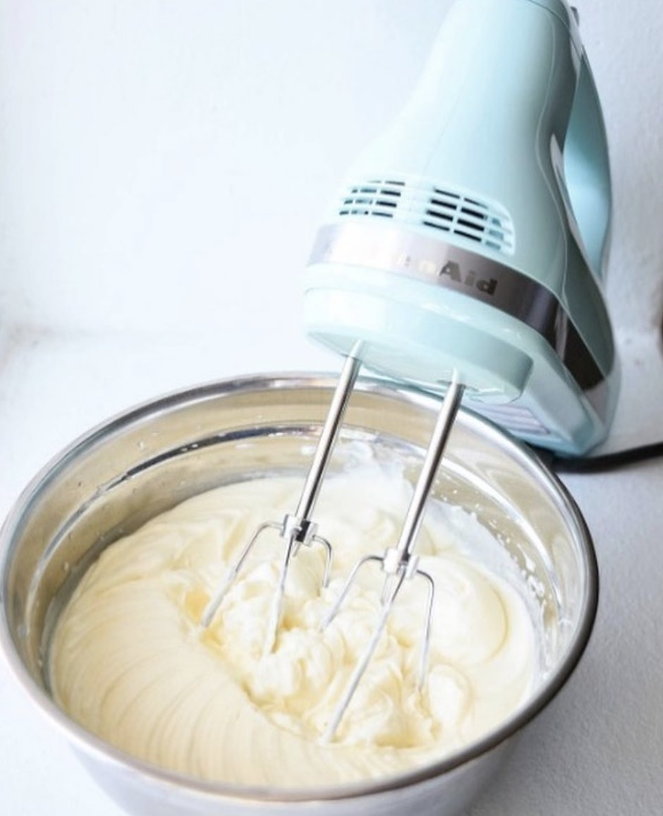 The hand mixer in a light blue color