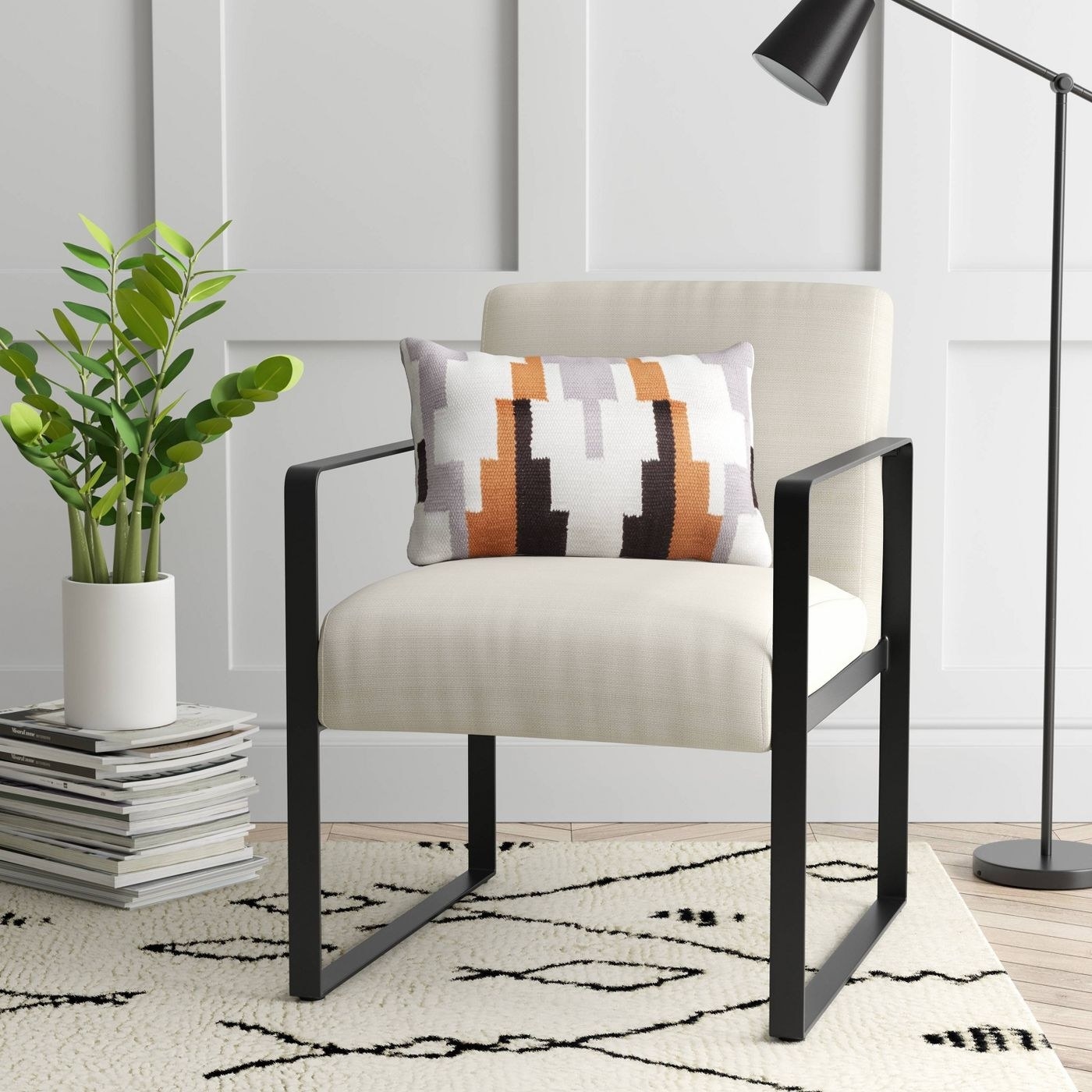 White upholstered chair with black metal frame 