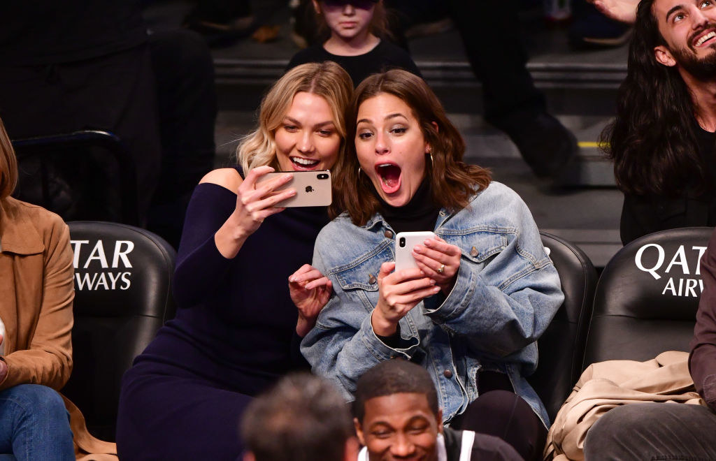 Karlie Kloss (L) and Ashley Graham attend Milwaukee Bucks v Brooklyn Nets game at Barclays Center 