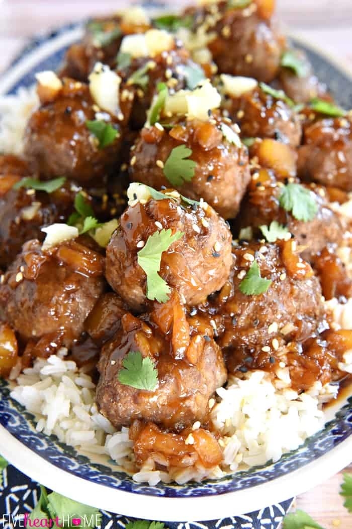 Large bowl of rice with Hawaiian meatballs piled high