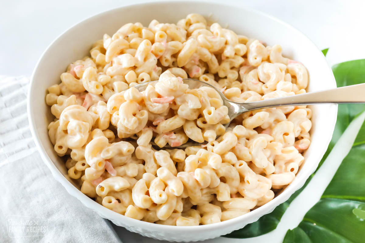 A large bowl filled with creamy macaroni salad