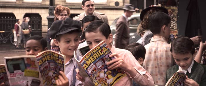 A group of young boys reading Captain America comics