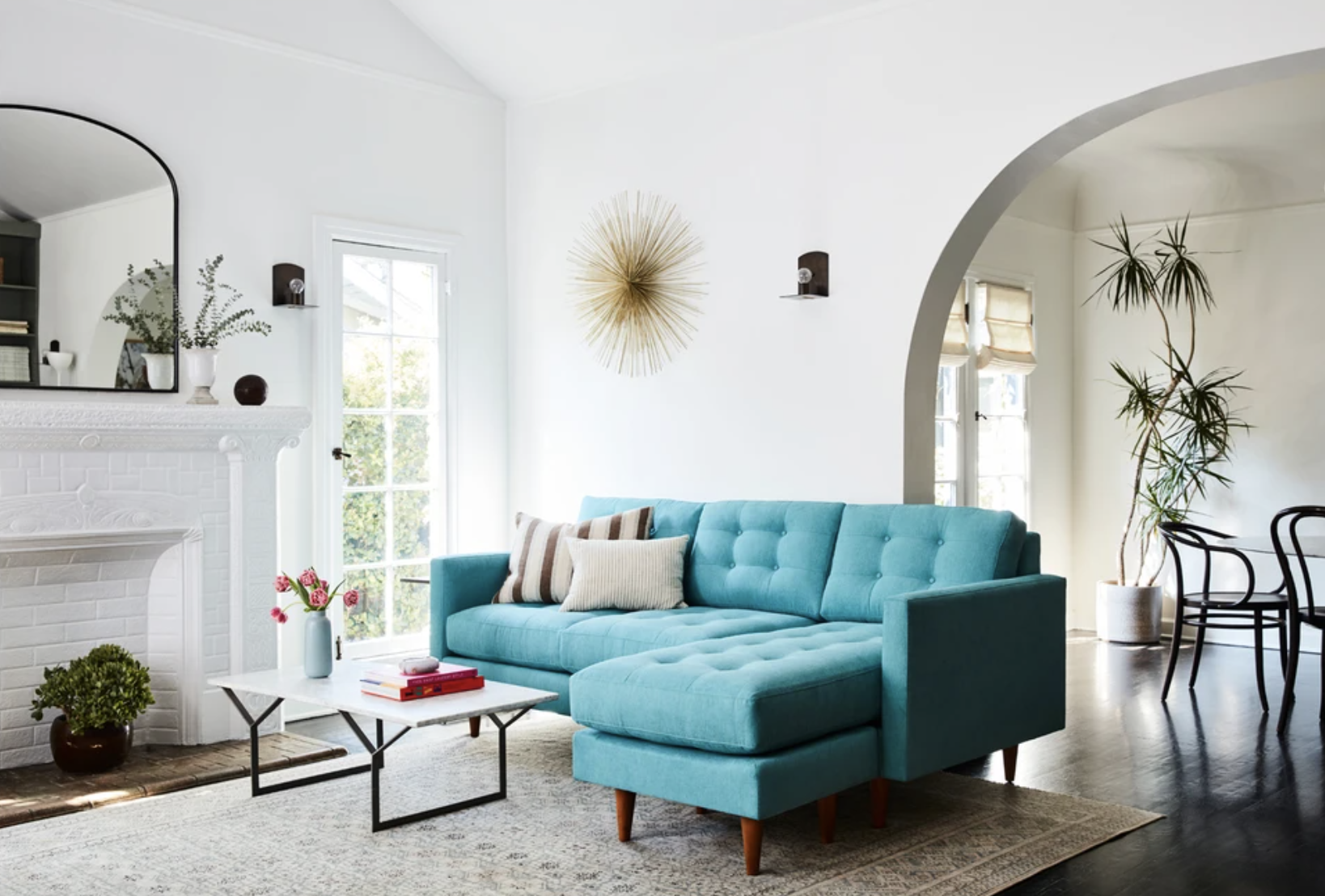 a teal sofa with a reversible chaise