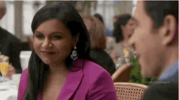 Mindy Kaling smiling and winking in &quot;The Mindy Show.&quot;
