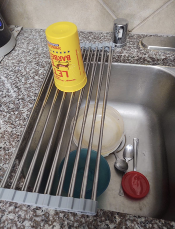 The same drying rack rolled slightly so it's over half the sink 