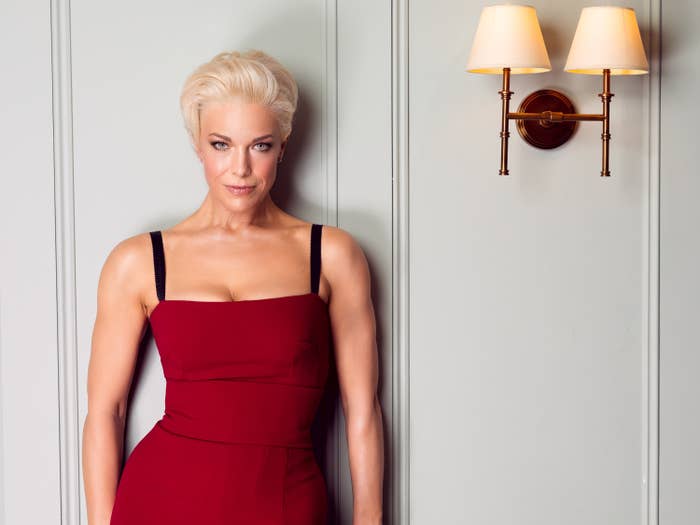 hannah waddingham psoing against a wall