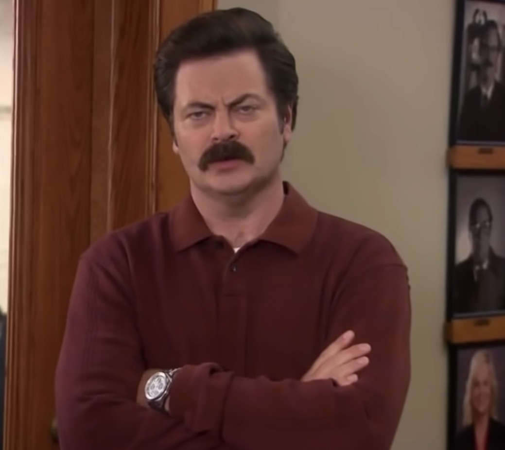 Ron Swanson from Parks and Rec with arms crossed