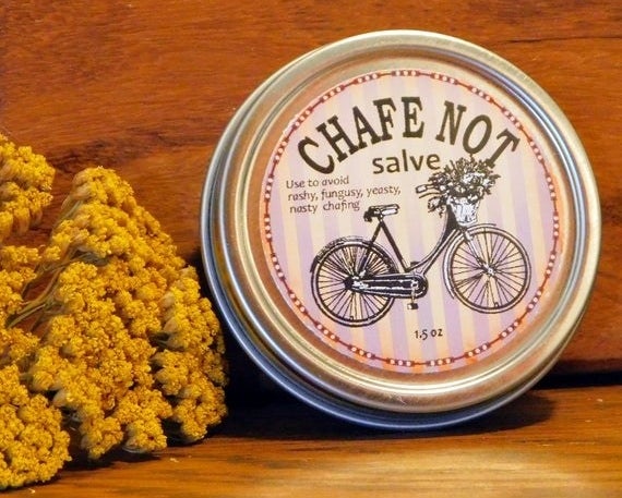 a tin that says &quot;chafe not salve&quot; with a picture of a bicycle 