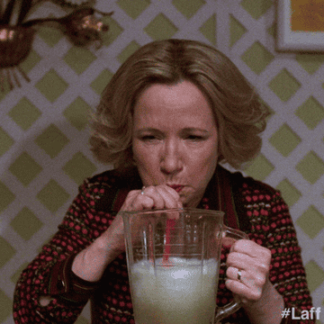 Debra Jo Rupp as Kitty Forman on That 70s show drinking out of blender with a straw
