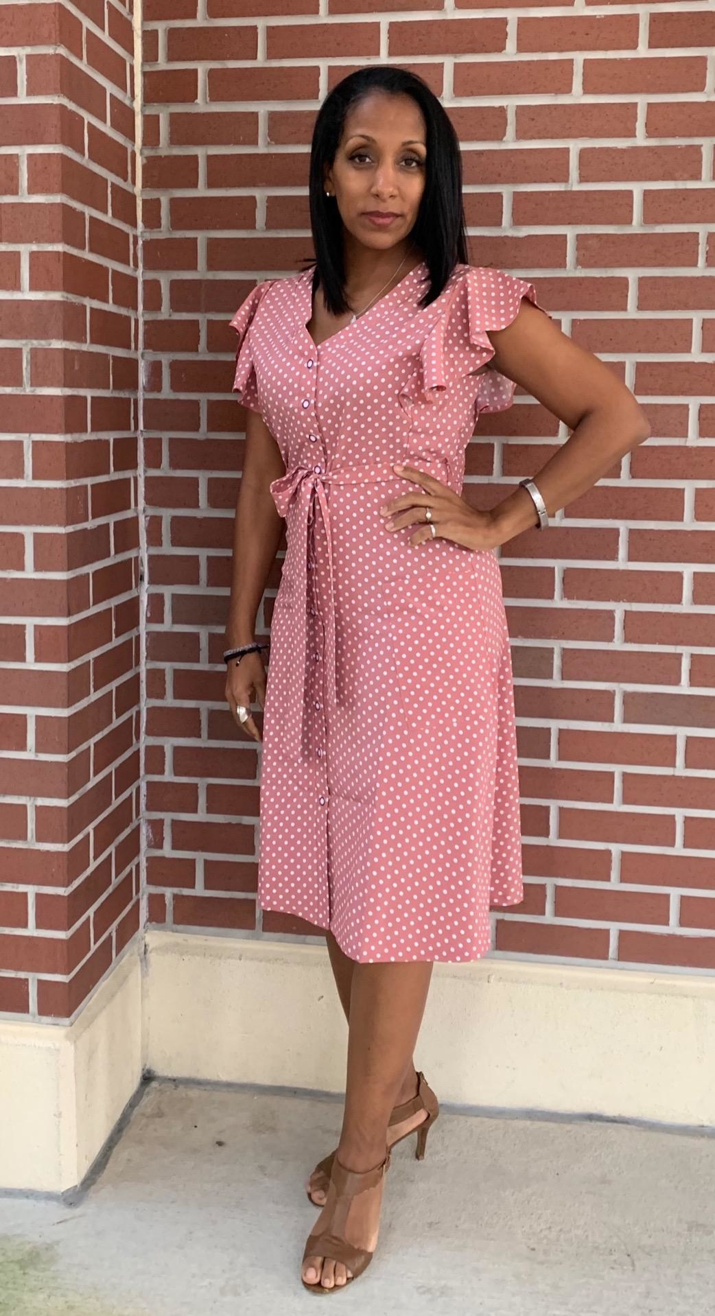 A reviewer photo of the dress in pink polka dot