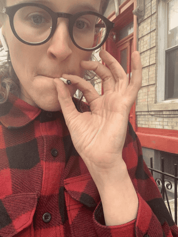 The author smokes a joint on the street