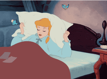 Cinderella covers her ears with her pillow because of loud birds