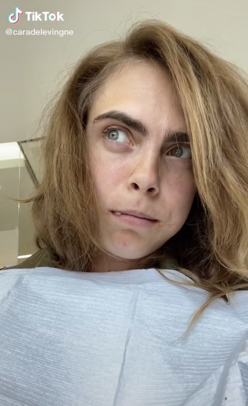Cara looks over to the other side of the room