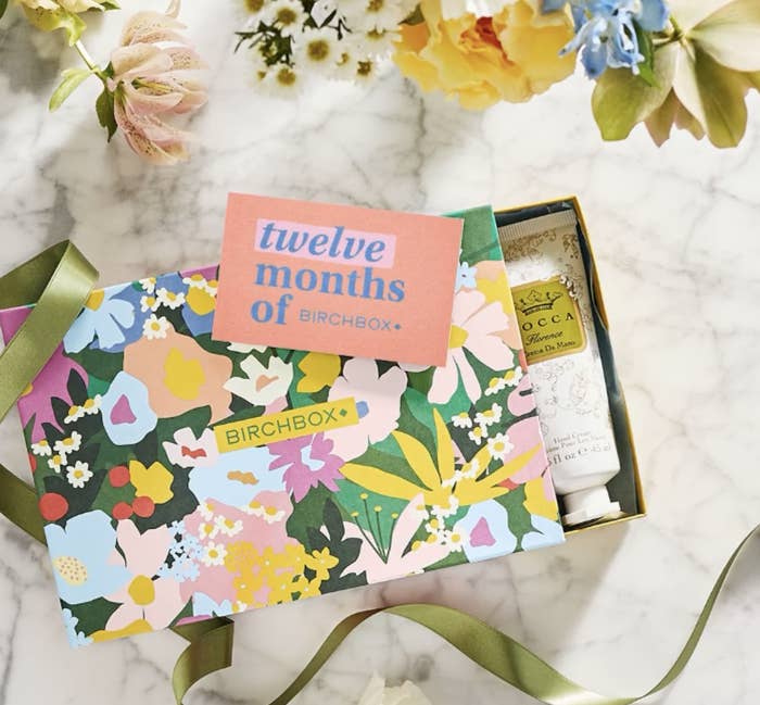 floral-print Birchbox subscription box with skincare products inside