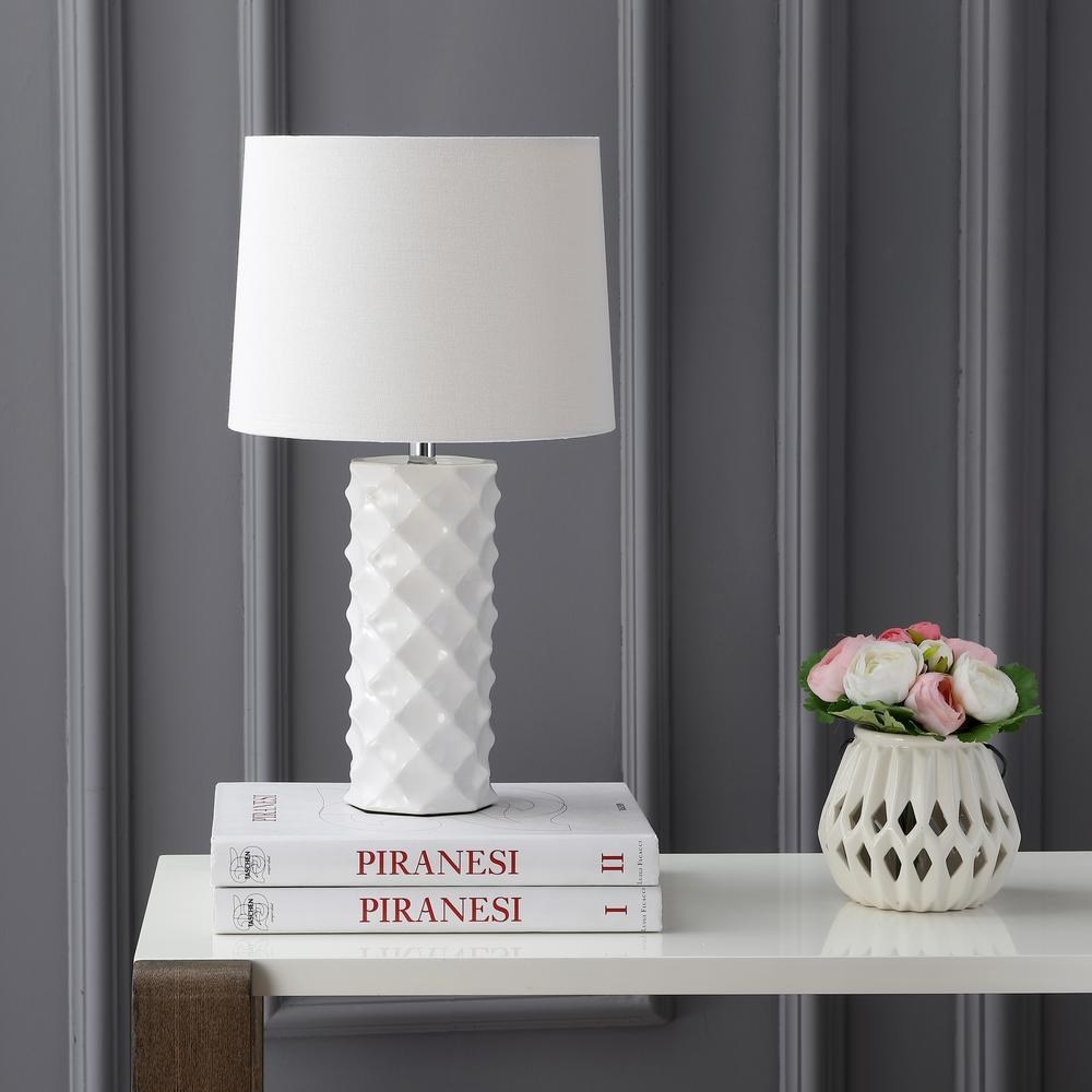 white table lamp with cylindrical criss cross textured base