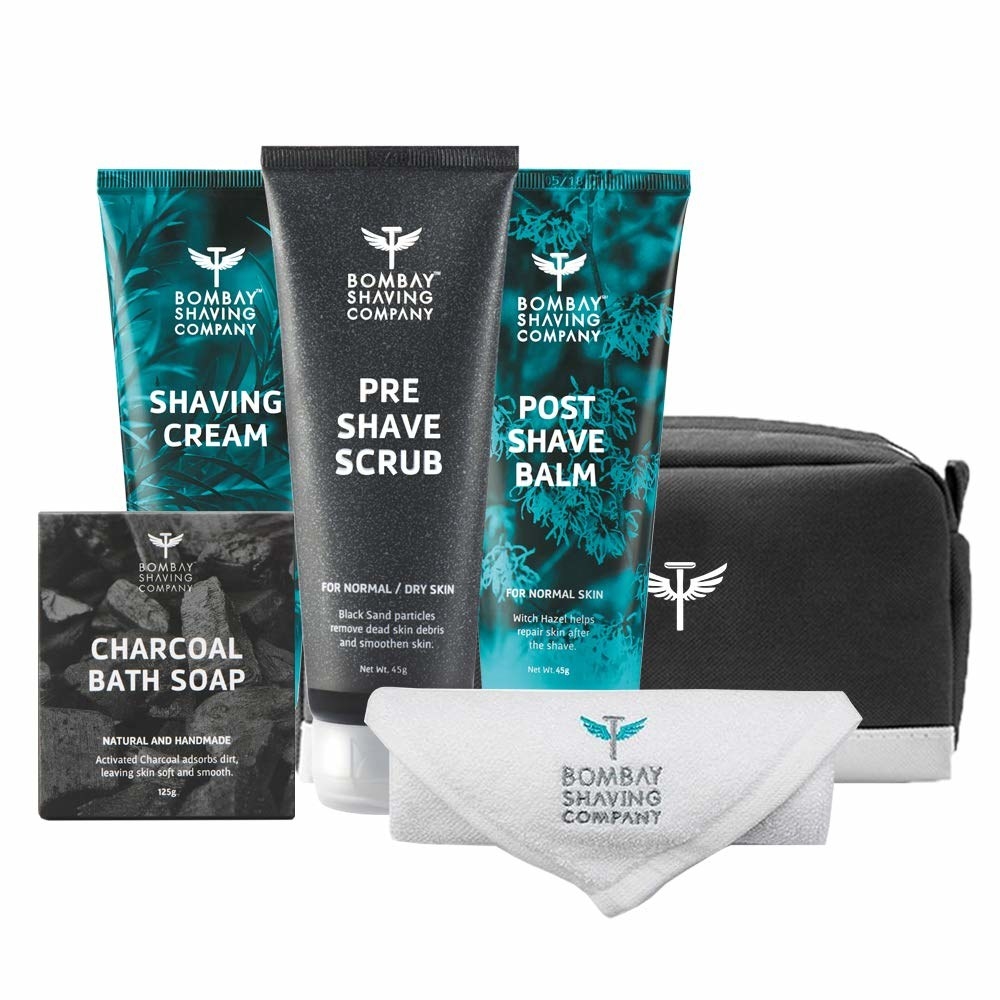 The kit contains a shaving cream, pre shave scrub, post shave balm, charcoal bath soap, face towel, and dopp bag