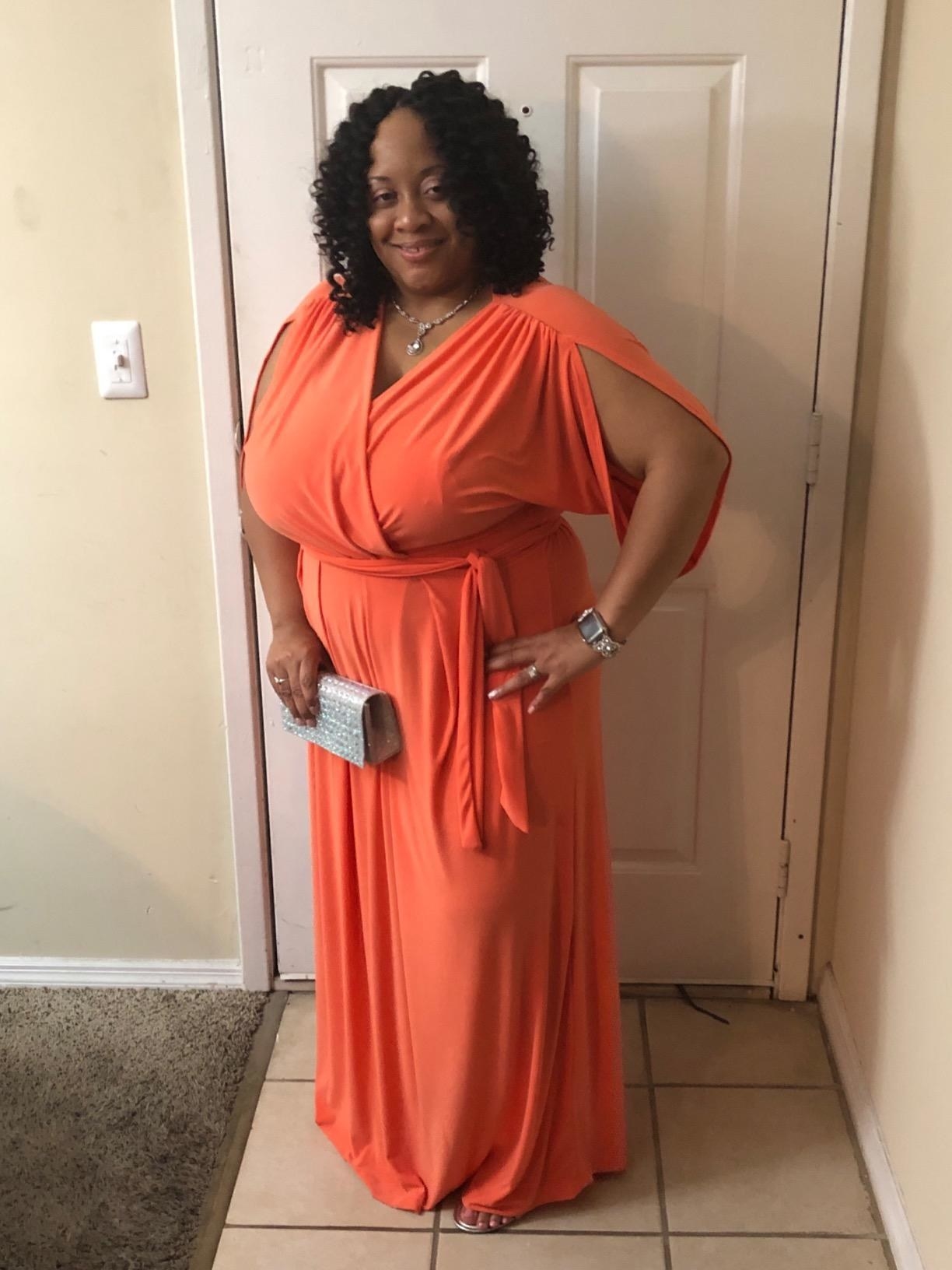 A reviewer photo of the dress in orange