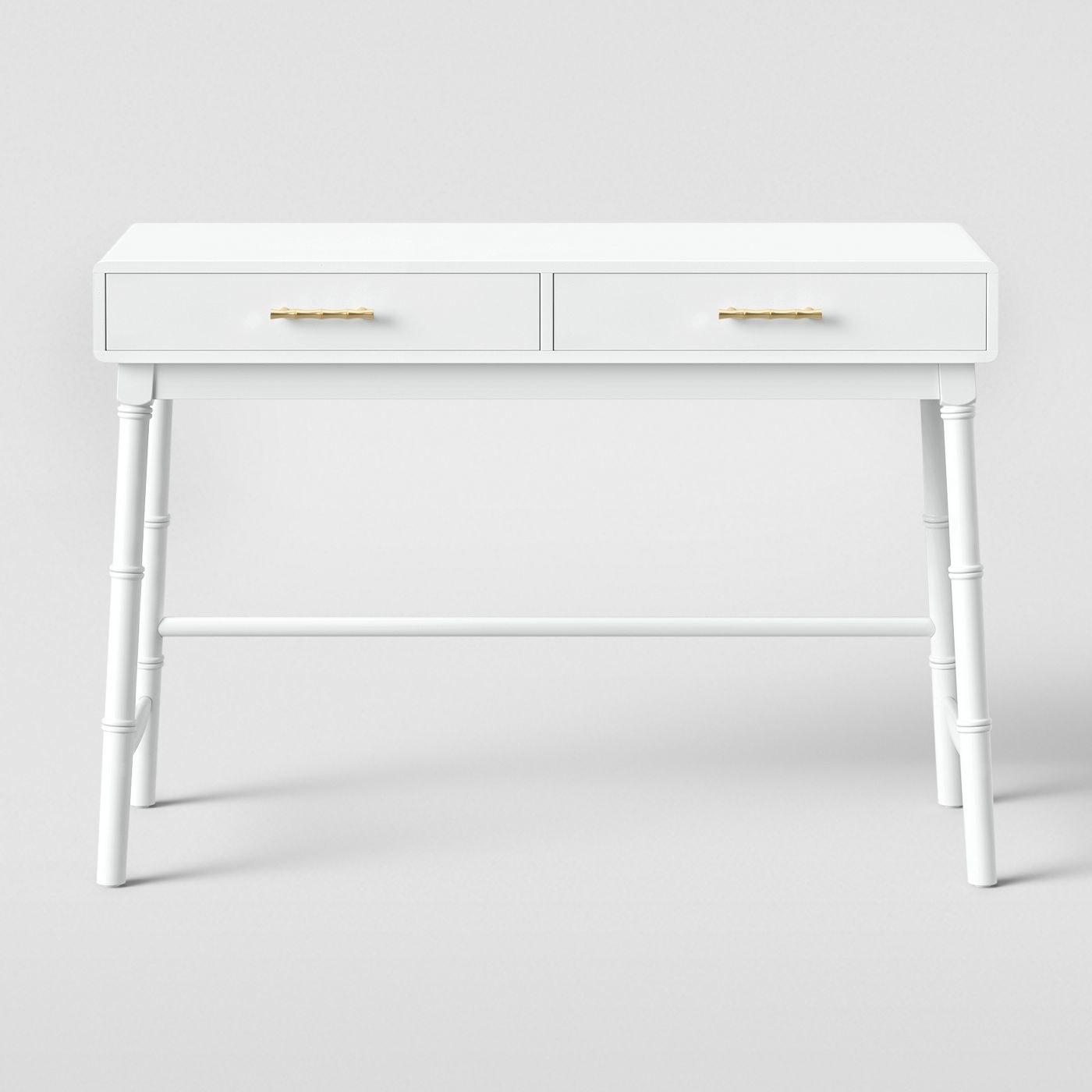 White rectangular desk with lets with legs with textured detailing