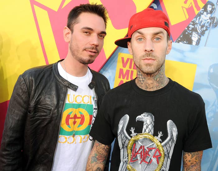 Travis stands next to DJ AM before the crash